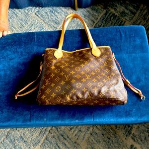Louis Vuitton authentic never full tote with authenticity card. Like new!
